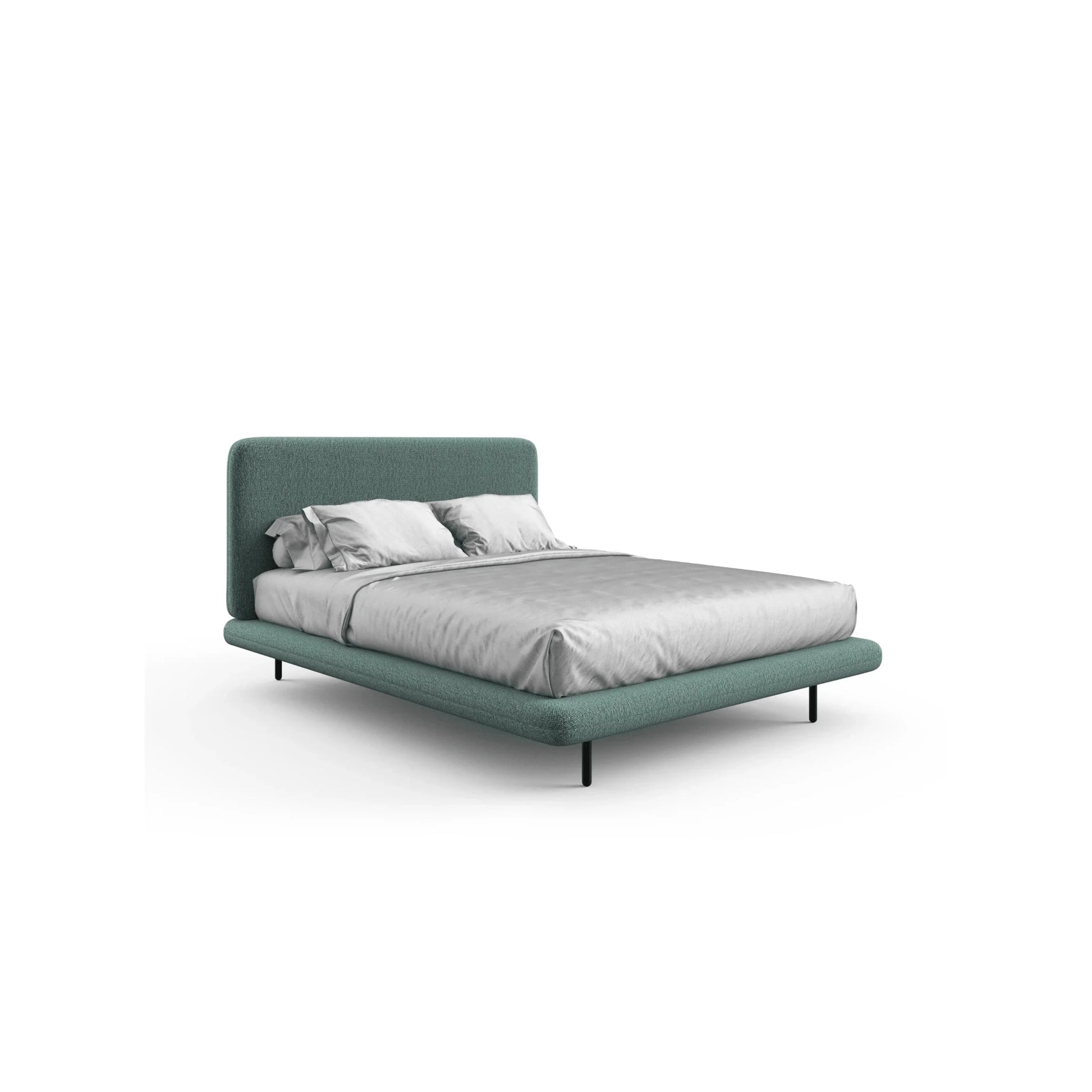Cama estofada com cabeceira alta e base verde-azulada, com roupa de cama branca.