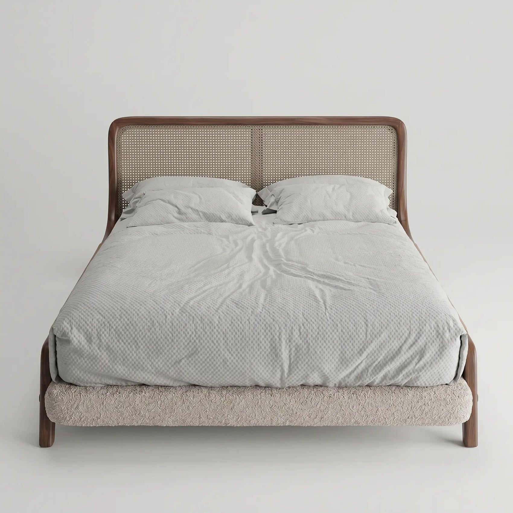 Cama estofada com cabeceira em tecido trançado e colchão com lençóis cinza claro