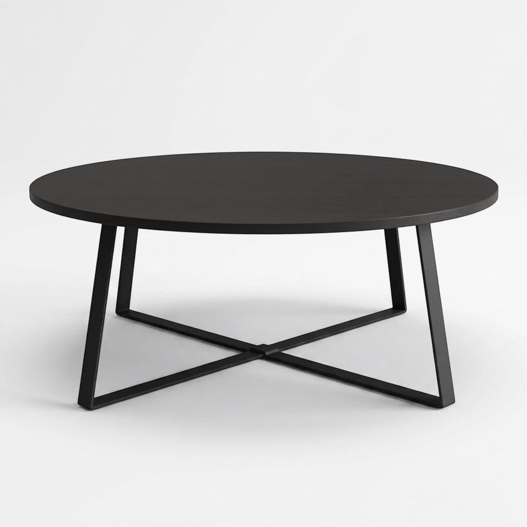 Horizon Interiores Zari Round black lacquered MDF coffee table with X-shaped base, 80cm diameter.