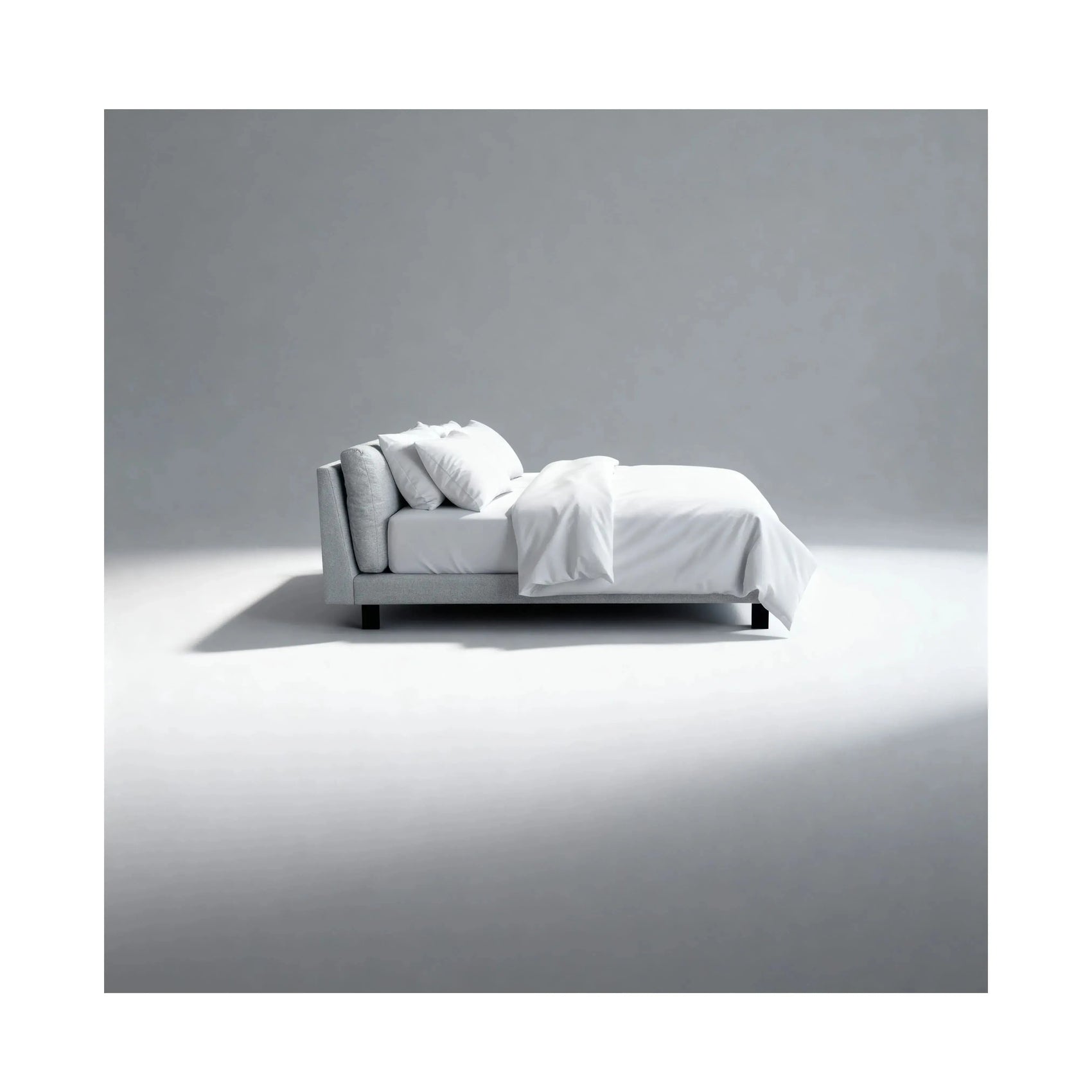 Cama Kairo – cama estofada retilínea com pés de aço pintados e almofadas soltas