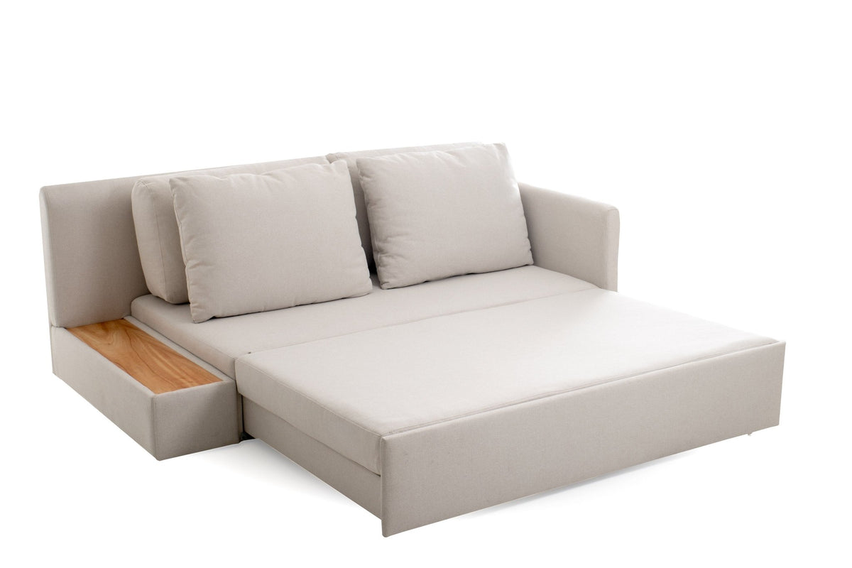 Sofá-cama aberto com encosto e duas almofadas, base estofada e nicho lateral