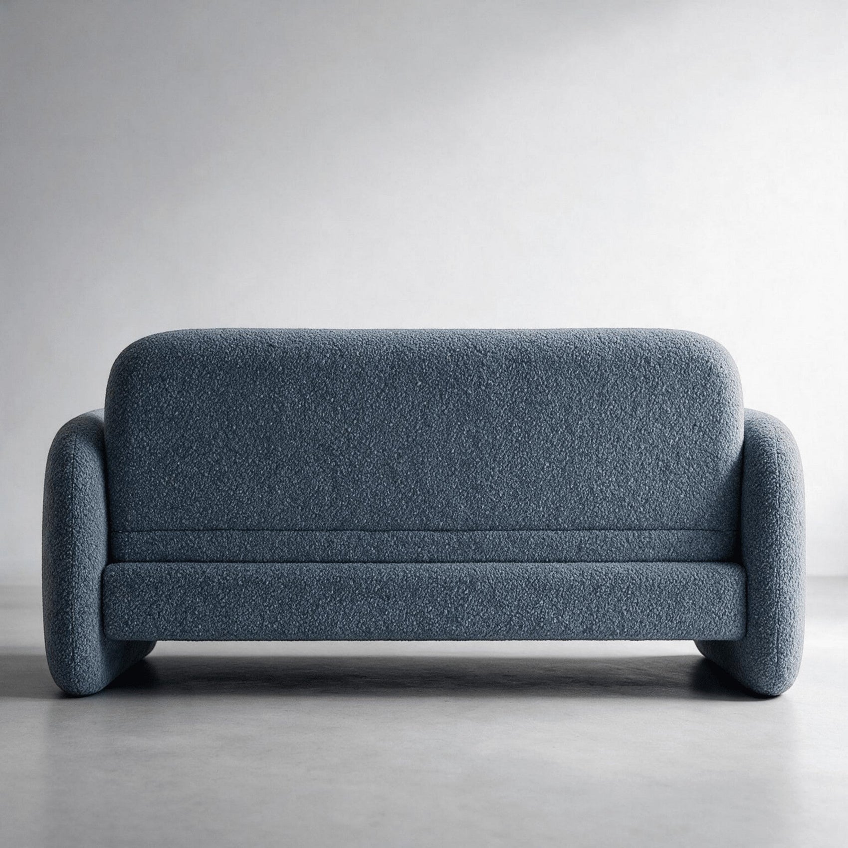 Sofá-cama estofado azul escuro com base baixa e braços curvos