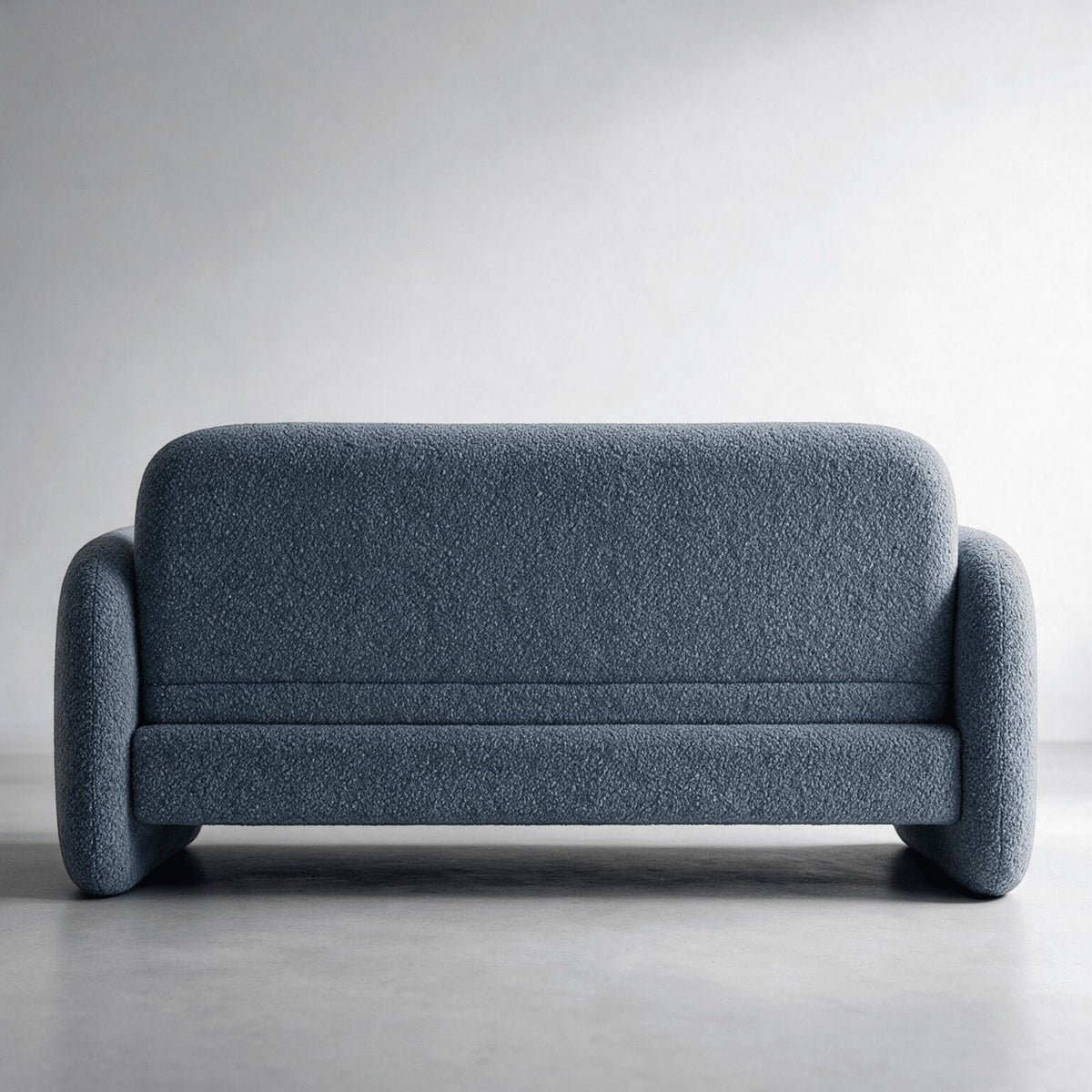 Sofá-cama estofado azul escuro com base baixa e braços curvos