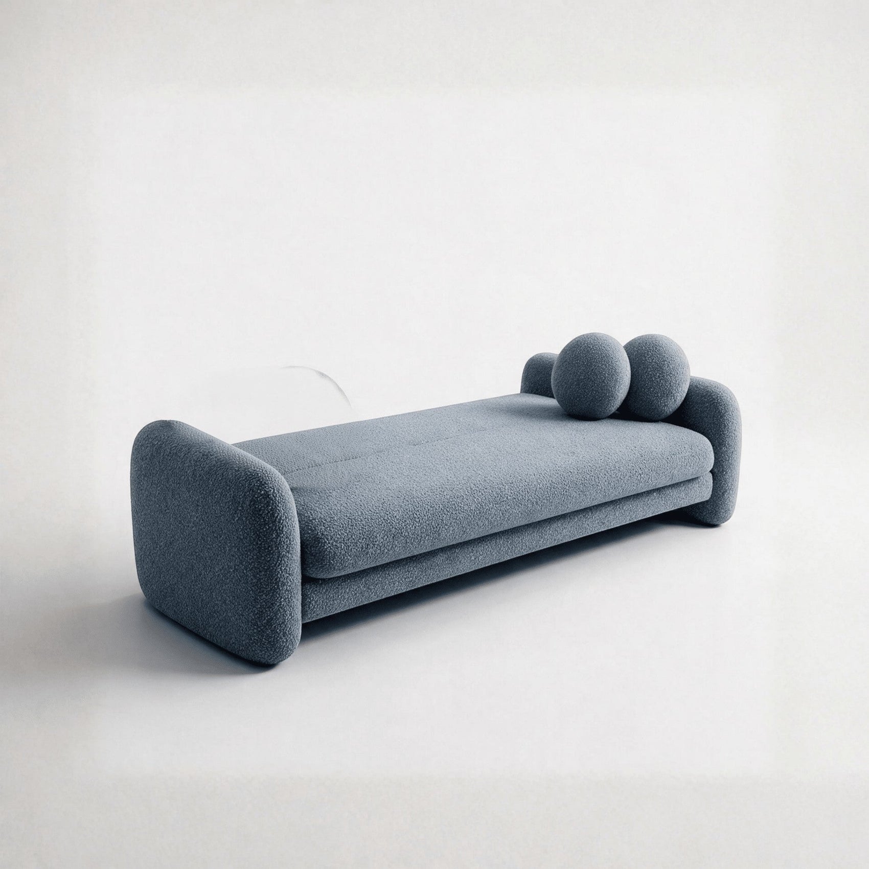 Sofá-cama estofado azul escuro com braços largos e almofadas arredondadas