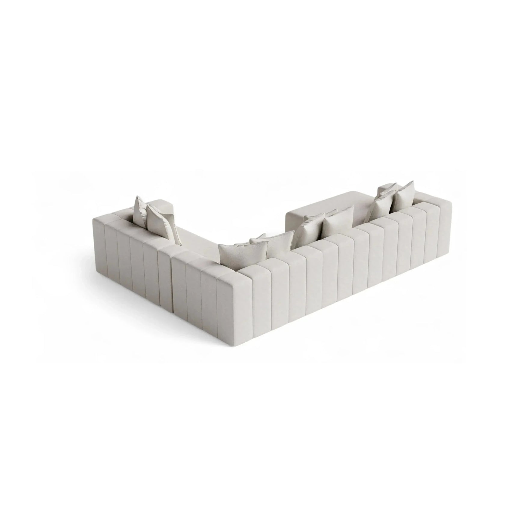 Sofá de canto modular em ângulo com almofadas e braços estofados, cinza claro.