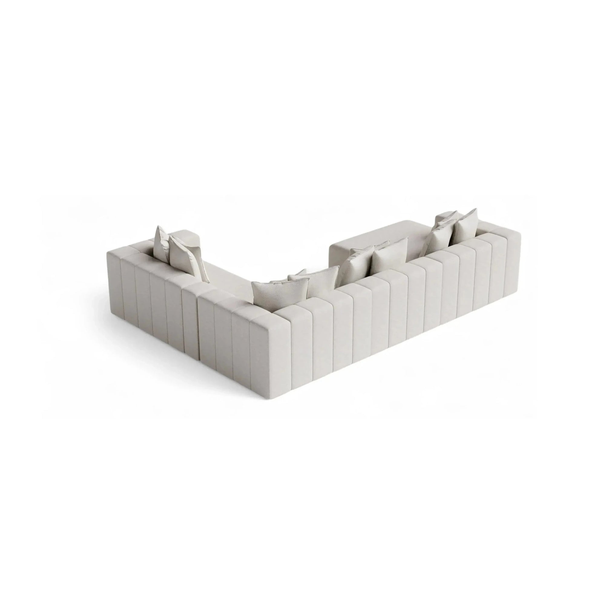 Sofá de canto modular em ângulo com almofadas e braços estofados, cinza claro.